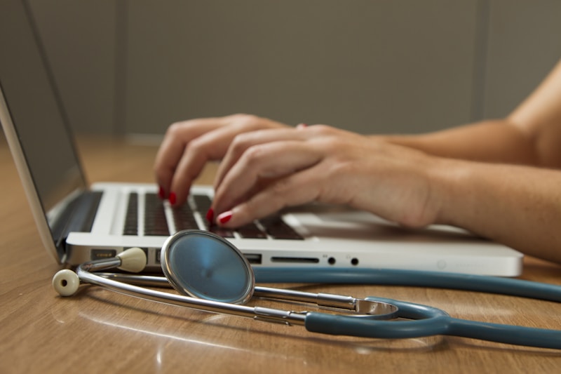 Medical professional reviewing patient health screening results